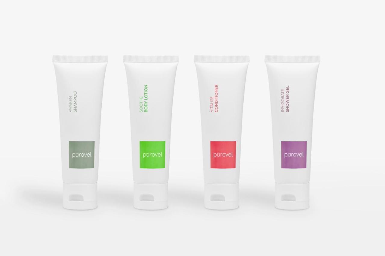 Paradox Singapore Merchant Court At Clarke Quay Exterior photo The photo shows four tubes of cream or lotion, each with a distinct color label. The tubes are all white with a flip-top cap at the bottom. From left to right, the first tube has a green label, the second a darker green, the third a red label, and th